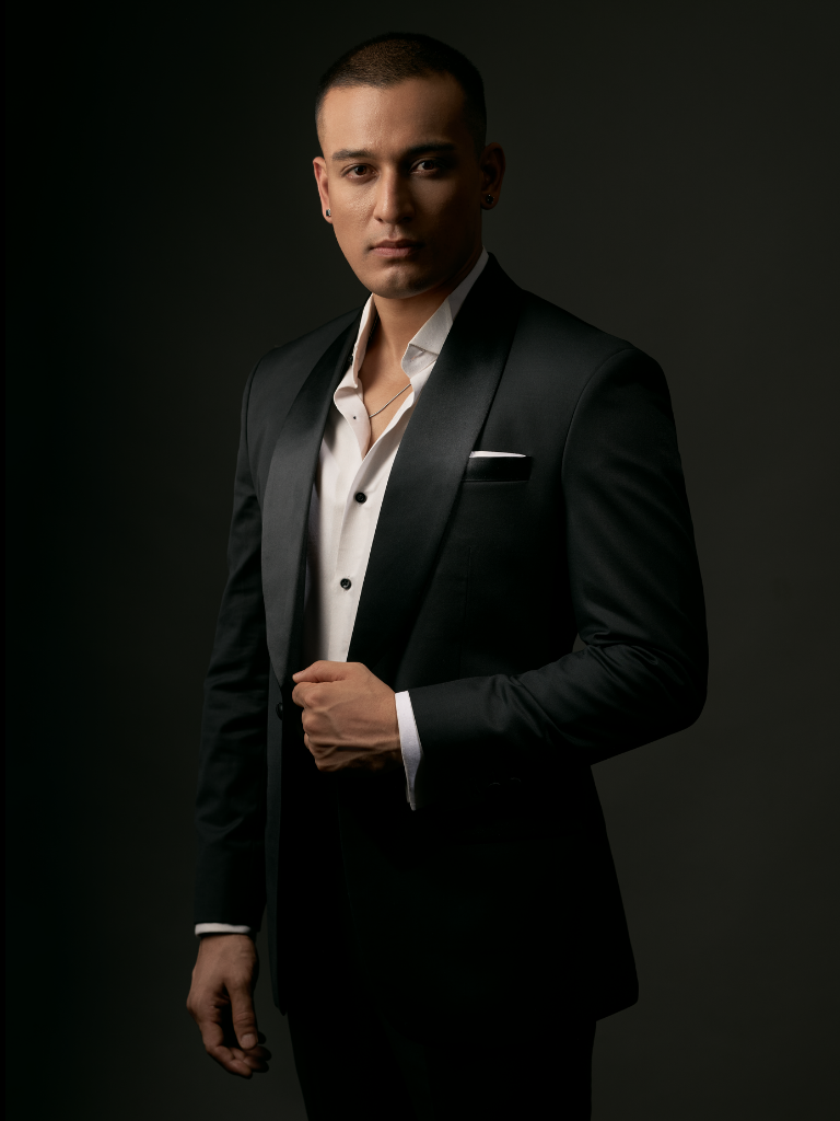 A bespoke black tuxedo made at The Suit Studio